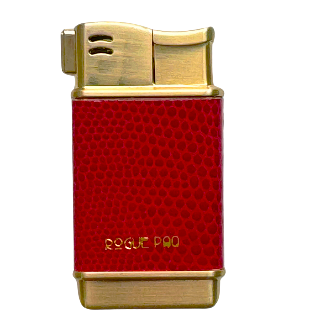 Rogue Paq refillable butane lighter in vibrant Cherry red. This forever lighter features a gold-tone finish and high-quality vegan skin, bringing a bold pop of color to the cannabis ritual.