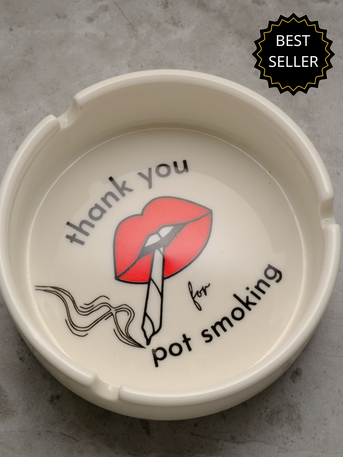 White porcelain cannabis ashtray featuring "Thank You For Pot Smoking" graphic in red and gold, designed like a vintage hotel ashtray.