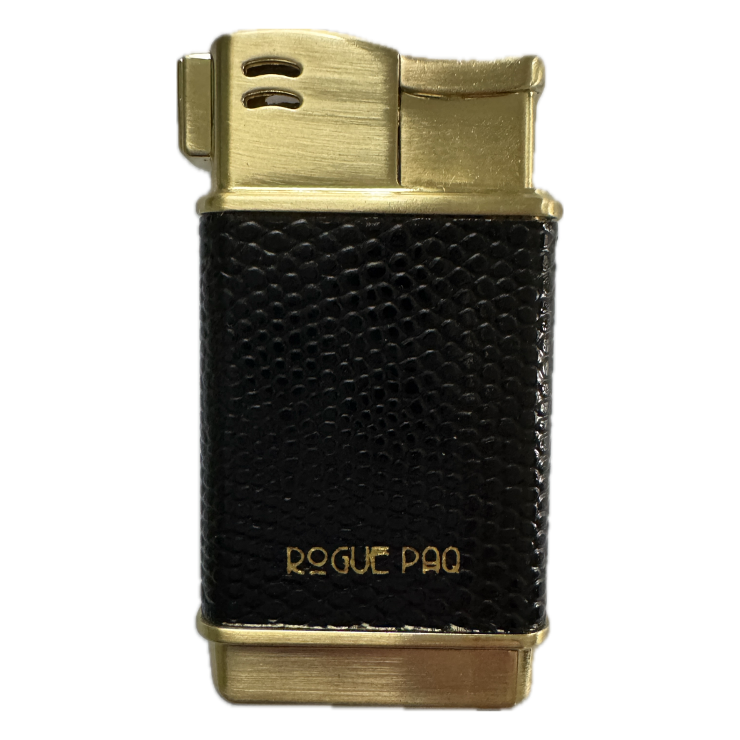 The Rogue Paq refillable lighter in Caviar. This luxury accessory features a sleek black vegan lizard-skin texture wrapped in a polished gold-tone frame. The design is timeless, sophisticated, and perfectly sized for a pocket or ritual case.
