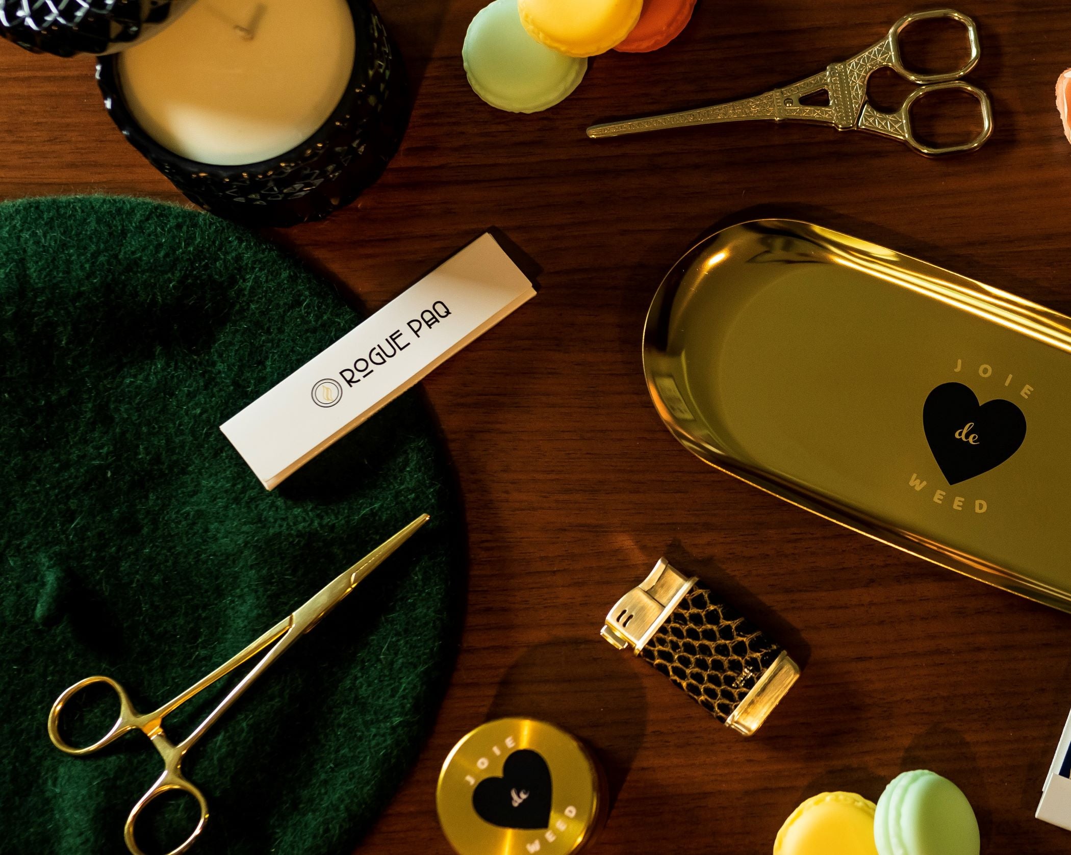 A lifestyle image showing the gold Eiffel Tower scissors along with the elements of the Joie de Weed Gift Set. The beautiful assortment of items highlights the gifting quality of Rogue Paq ritual items.