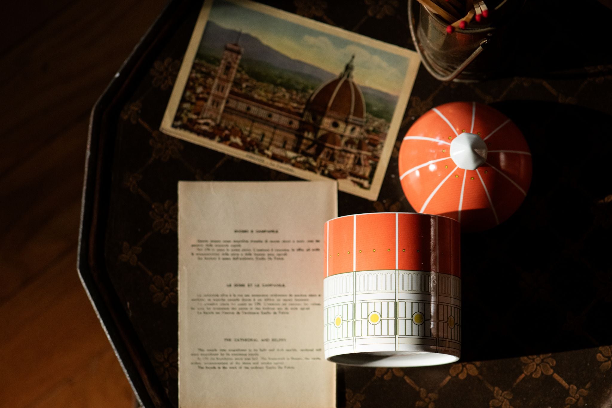 Our Duomo Heaven Scent candle  with a postcard of the actual Duomo in Florence Italy which highlights the architectural nature of the piece. 