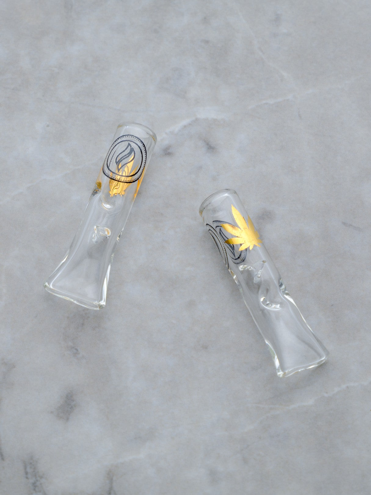 A pair of premium borosilicate glass rolling tips, also known as crutches, presented in a clean, minimalist 2-pack. Each tip features a sleek, transparent finish with the 'Rogue Paq' logo etched subtly in black serif typography.