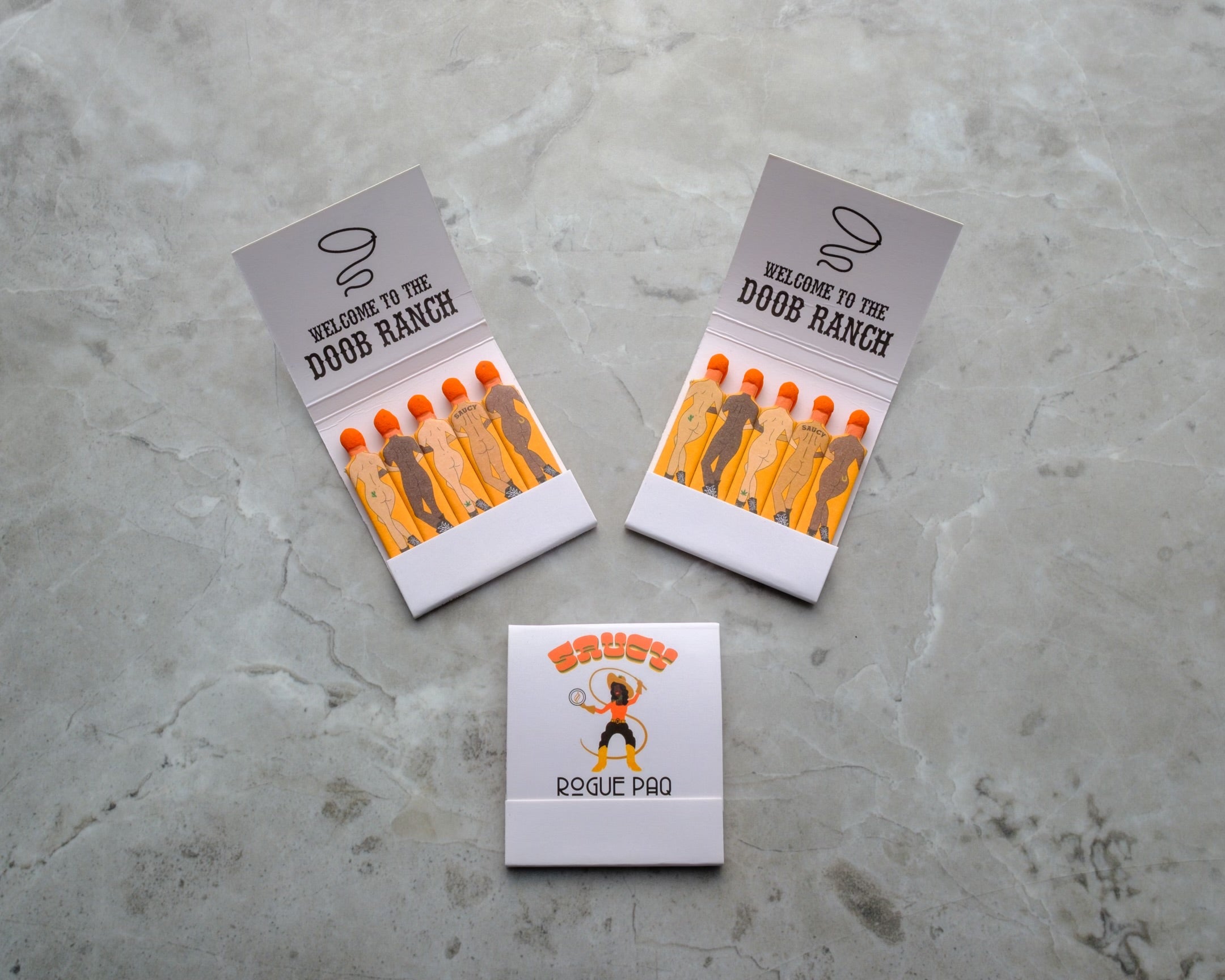 Three books of Doob Ranch matchbooks with tiny cowboy and cowgirl figures. 