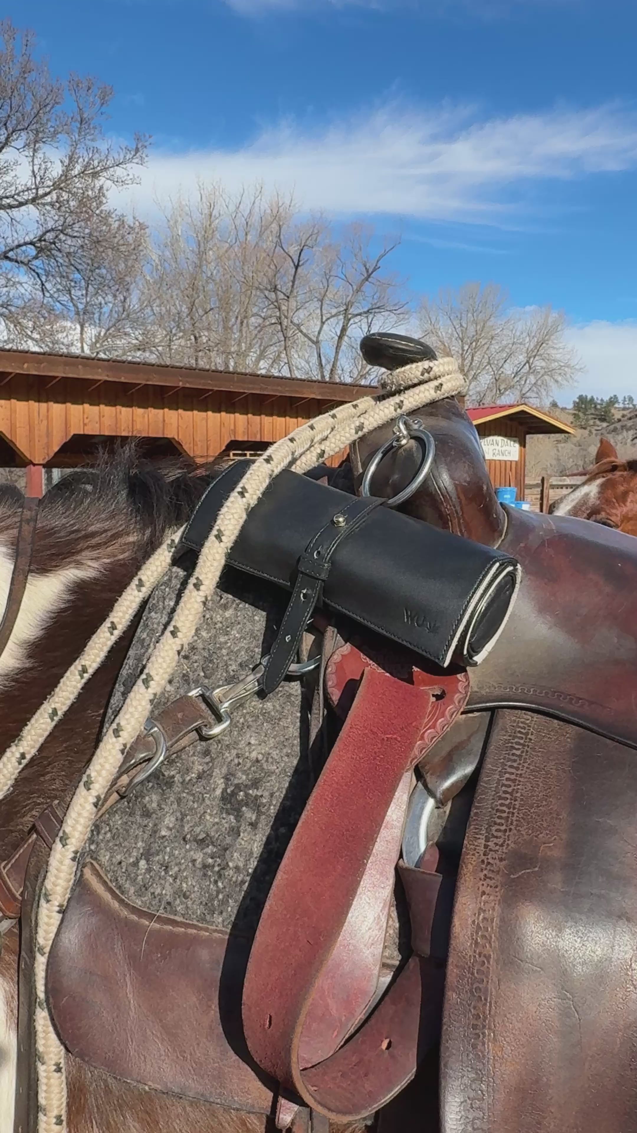 short video of the Rogue Paq Ritual Case in lambskin leather strapped to a horse's saddle's pommel. This highlights the case's durability and its heritage as a modern, luxury version of a traditional tool roll.