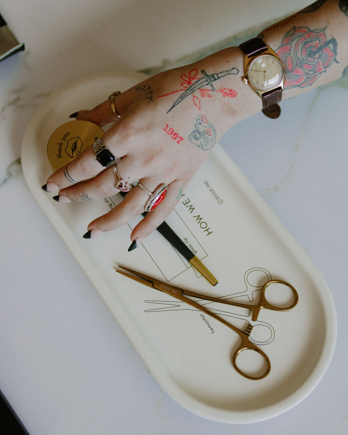 Porcelain How We Roll valet tray styled as a chic coffee table catch-all; elegant decor that serves as both a rolling station and a conversation piece.