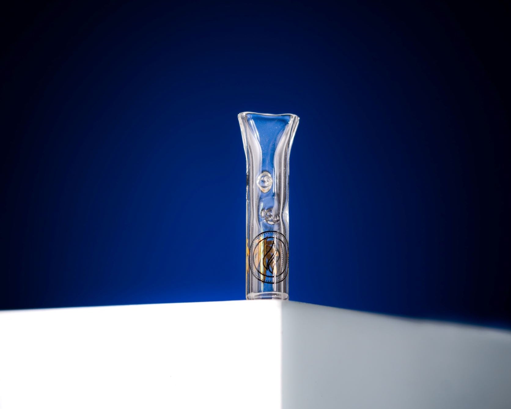 A macro shot looking through the glass tip to show the internal glass 'pinch.' This functional design element acts as a built-in screen to prevent debris or particles from passing through while allowing for maximum airflow and cooling.