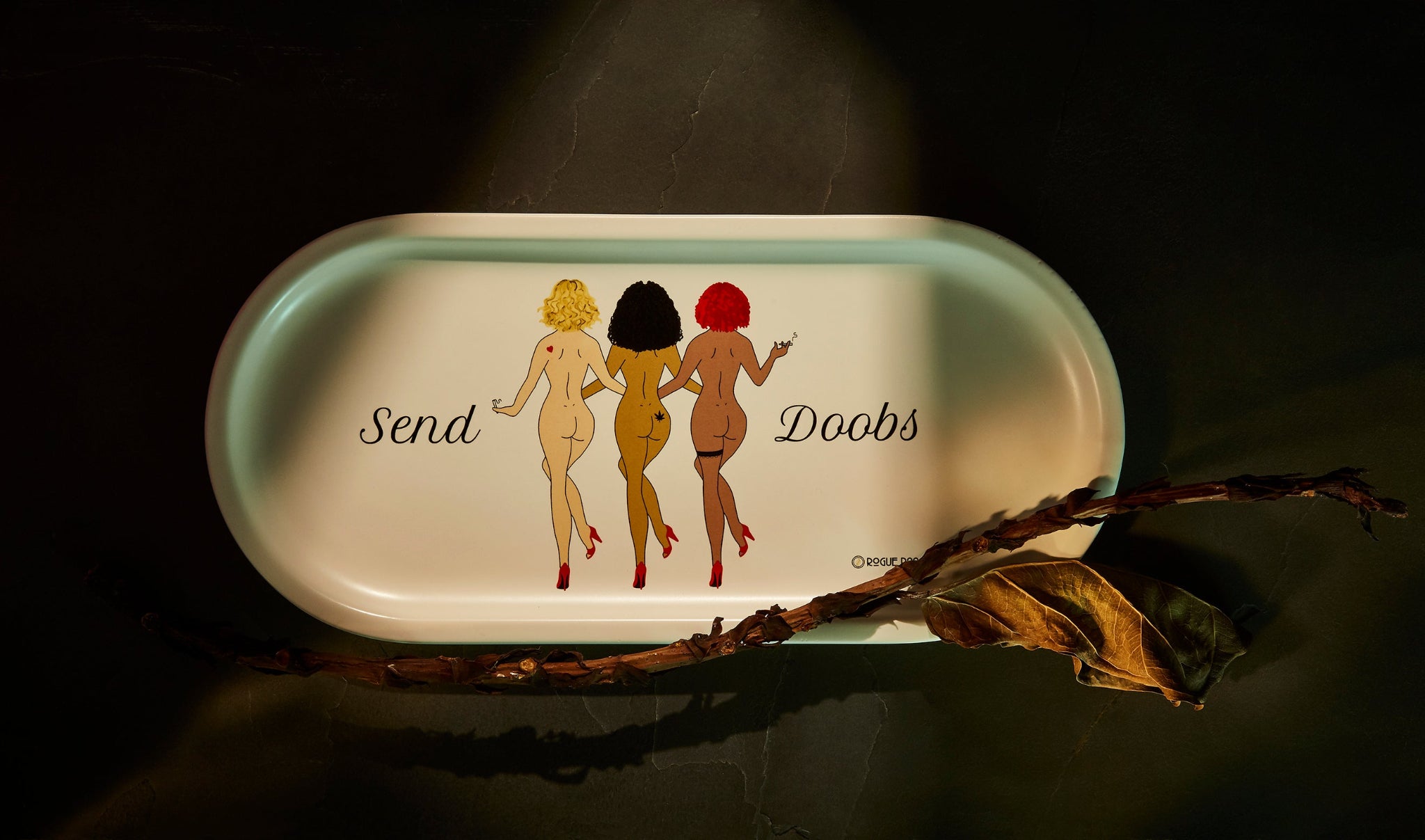 Close up of the elegant details on the Send Doobs porcelain valet tray. The dancers are shown in a diverse spectrum of skin tones to celebrate a sexy and inclusive ritual. 
