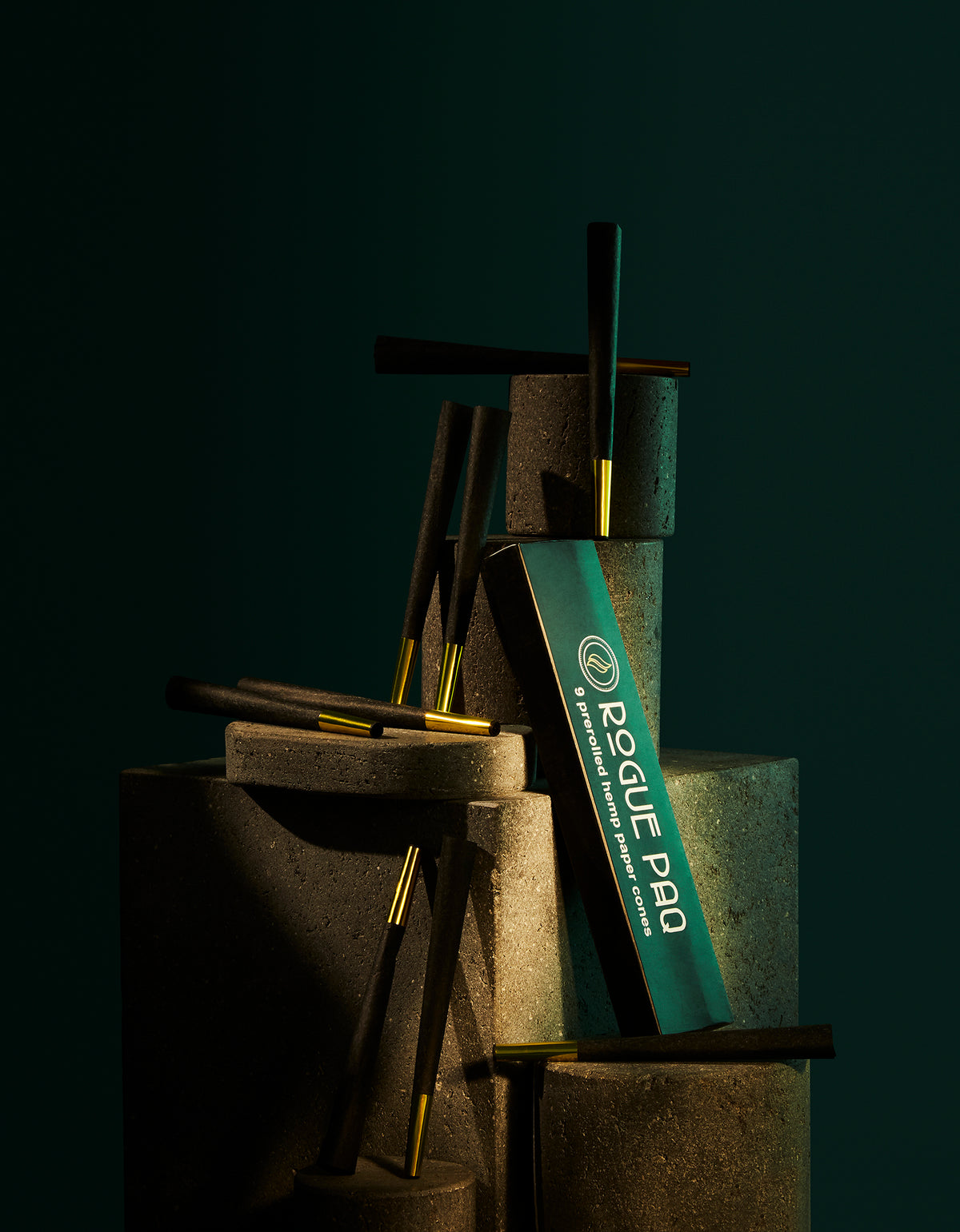 Set of 9 Rogue Paq pre-rolled cones nested in groups of three with included tamping tool; a convenient and design-forward alternative to hand-rolling joints.