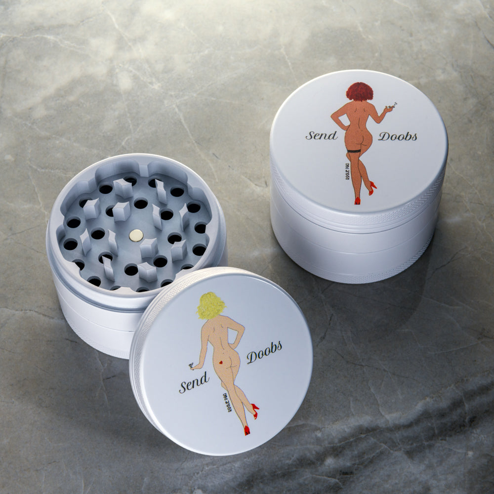 Rogue Paq 60mm grinder showing diamond-shaped cutting teeth and stainless steel pollen filter; designed to produce fluffy ground herb without sticking.