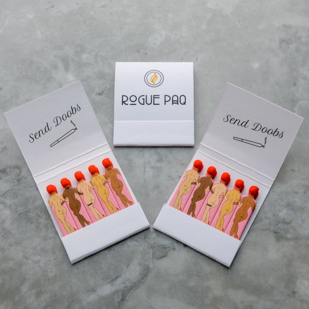 Rogue Paq SendNudes Matches: Send Doobs set of 3 premium matchbooks featuring vintage-style can-can dancing figures with distinctive red hair for a whimsical cannabis ritual. 